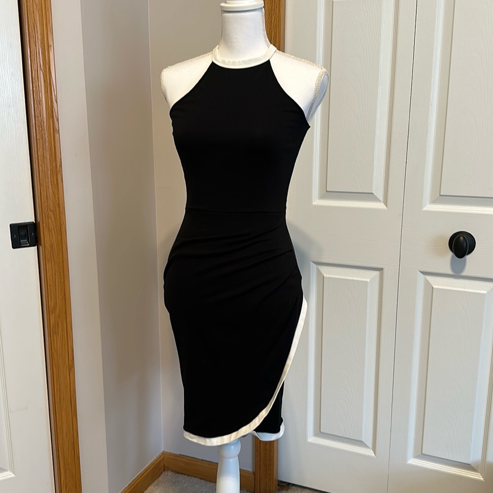 MYSTIC black body con dress with white trim.